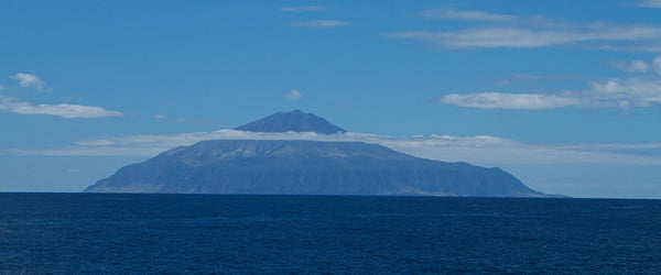 Tristan da Cahuna Love Socks Island. Image by By Brian Gratwicke from DC, USA - Tristan da Cunha - a perfect volcanic coneUploaded by snowmanradio, CC BY 2.0, https://commons.wikimedia.org/w/index.php?curid=20763903
