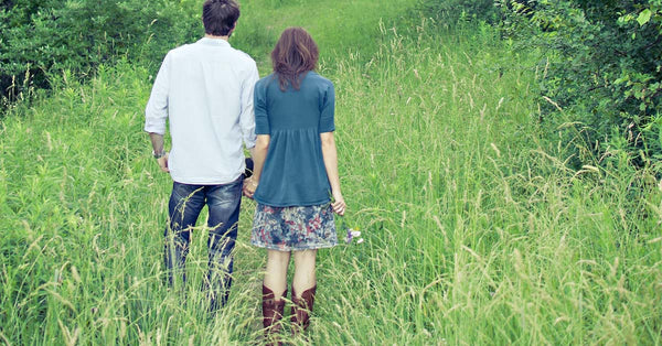 Man and woman in grassy field