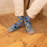 men wearing blue Royal Flush Men's Socks in the kitchen wearing white pants