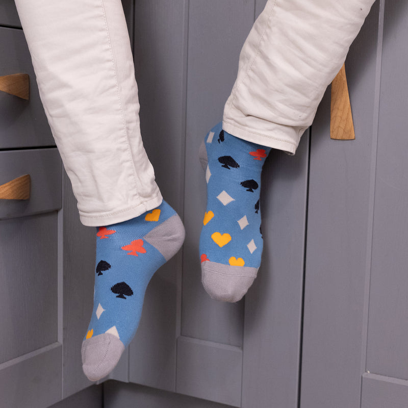 men wearing blue Royal Flush Men's Socks in the kitchen wearing white pants