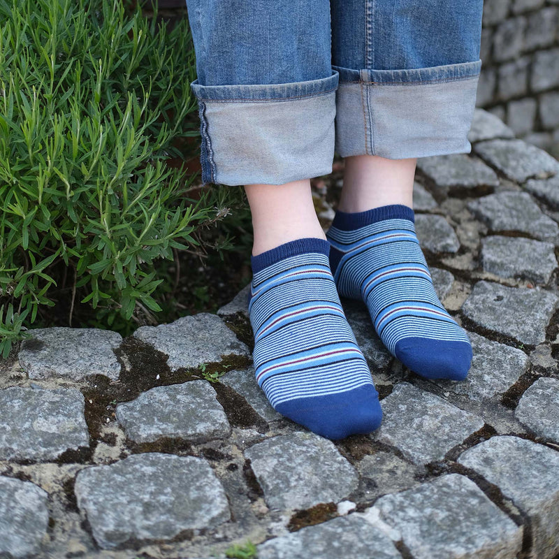 Man wearing Peper Harow navy Multistripe men's luxury trainer socks outdoors