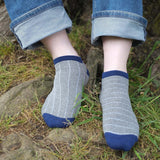 Man wearing Peper Harow grey Dash men's luxury trainer socks outdoors