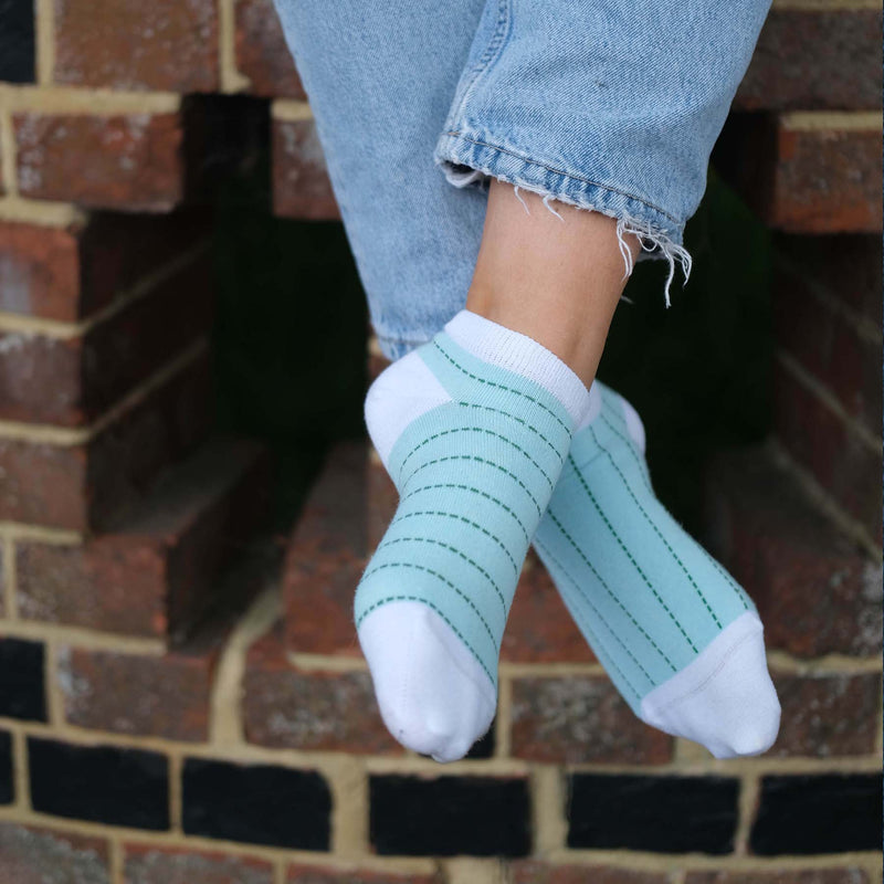 Women wearing Peper Harow mint Dash women's luxury trainer socks outdoors