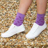 Woman wearing Peper Harow violet Leaf luxury women's socks
