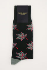 A grey and red maple leaf on coal black socks with packaging