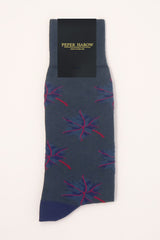 A navy, matte blue and red maple leaf on matte blue socks with packaging