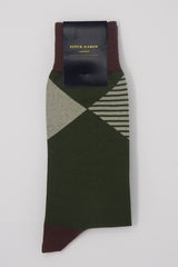 Green socks with a brown cuff, heel and toe, with a grey diamond shaped pattern around the ankle in packaging