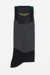 A pair of Onyx men's chevron socks in packaging, with a white V striped pattern down the calf, and a turquoise line circling the top of the cuff