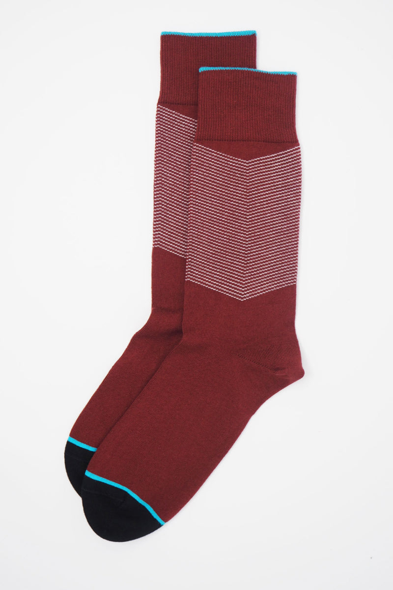 A pair of Garnet men's chevron socks, with a white V striped pattern down the calf, and a turquoise line circling the toes and the top of the cuff