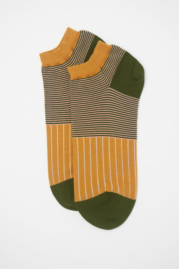 Peper Harow mustard oxford stripe egyptian cotton trainer socks with a green heel and toe and green and pink horizontal stripes around the ankle, with cream vertical stripes down the foot