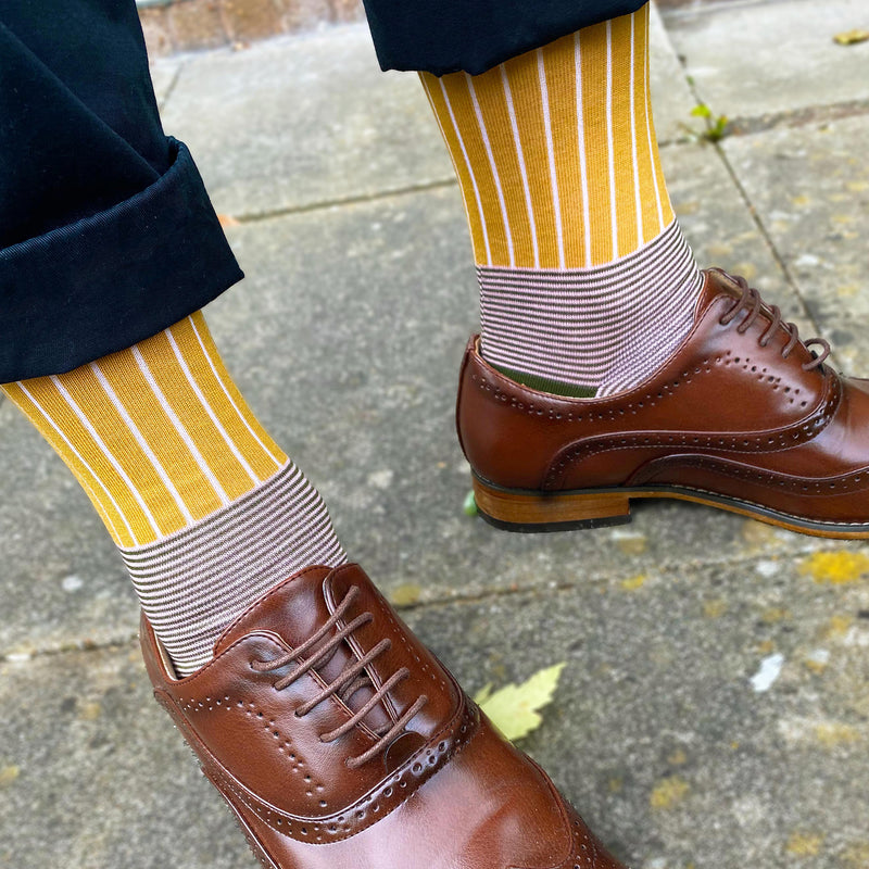 Man in brown brogues wearing Peper Harow mustard Oxford stripe socks