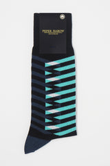 Symmetry black men's luxury socks by Peper Harow, featuring stylish aqua and navy blue stripes, and a navy heel and toe in packaging.