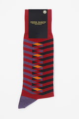 Symmetry red men's luxury socks by Peper Harow, featuring stylish purple and black stripes, and a purple heel and toe in packaging.