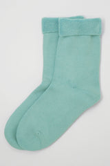 Two pairs of Peper Harow women's blue Plain luxury bed socks showing fluffy inside