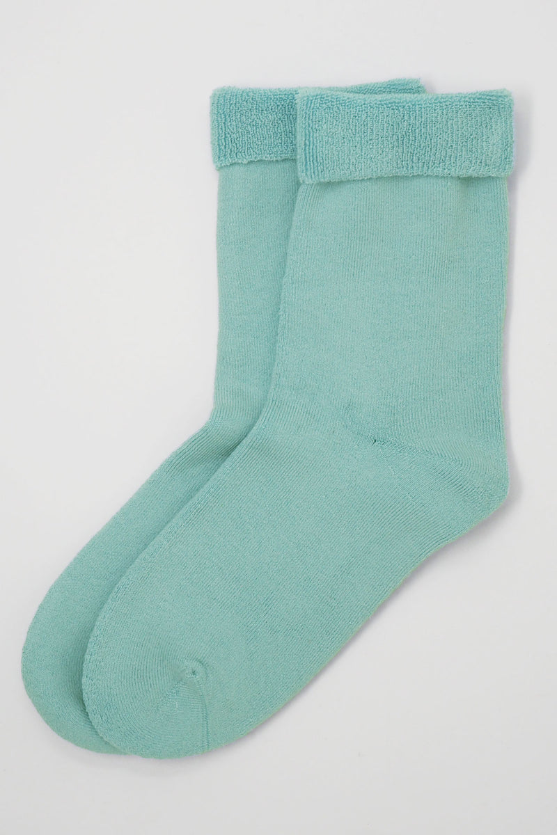 Two pairs of Peper Harow men's blue Plain luxury bed socks showing fluffy inside