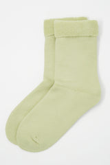 Two pairs of Peper Harow men's cream Plain luxury bed socks showing fluffy inside