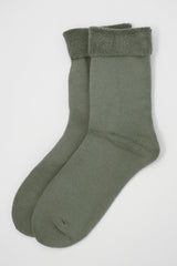 Two pairs of Peper Harow men's grey Plain luxury bed socks showing fluffy inside