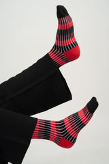 Legs in the air wearing Peper Harow red Chord women's luxury socks