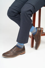Man wearing a suit and Peper Harow blue Chord men's luxury socks