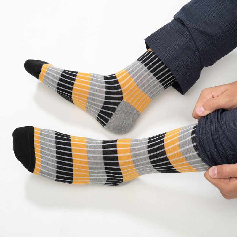 Close up of man wearing Peper Harow mustard Chord men's luxury socks