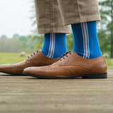 Man wearing brown shoes, tan trousers and blue Andover men's luxury socks by Peper Harow