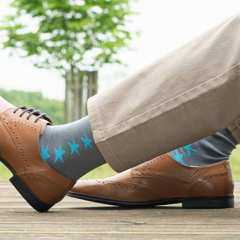 Man wearing brown shoes, tan trousers and Peper Harow grey Starfall men's luxury socks