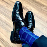 Man wearing shiny black shoes and navy Check men's luxury socks by Peper Harow