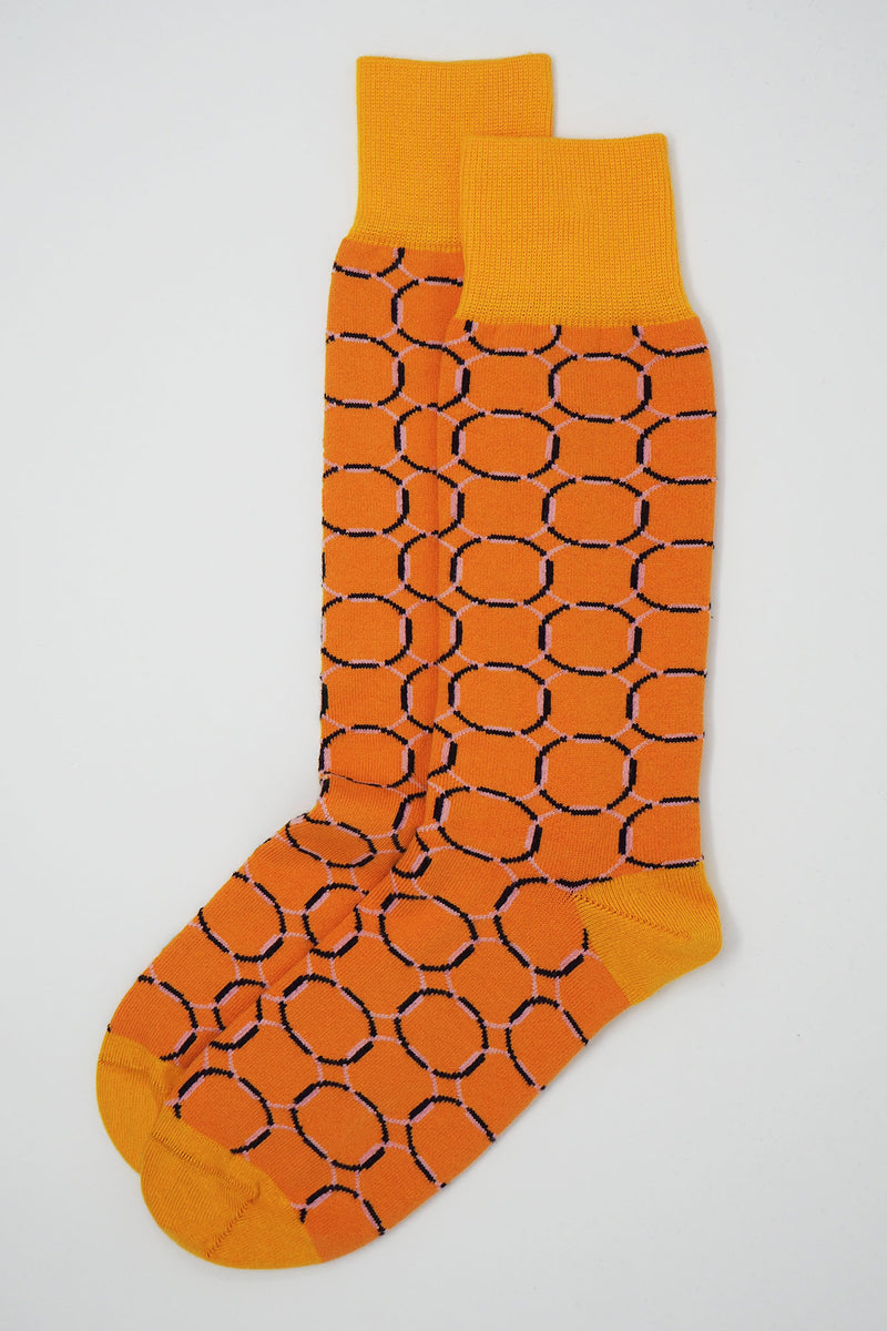 two Orange Linked men's luxury patterned socks by Peper Harow side by side